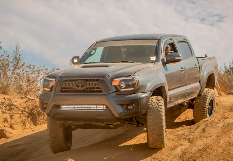 Cali Raised 05-15 Toyota Tacoma Low Profile Led Ditch Light Brackets Kit W/ Blue Backlight - Small 1