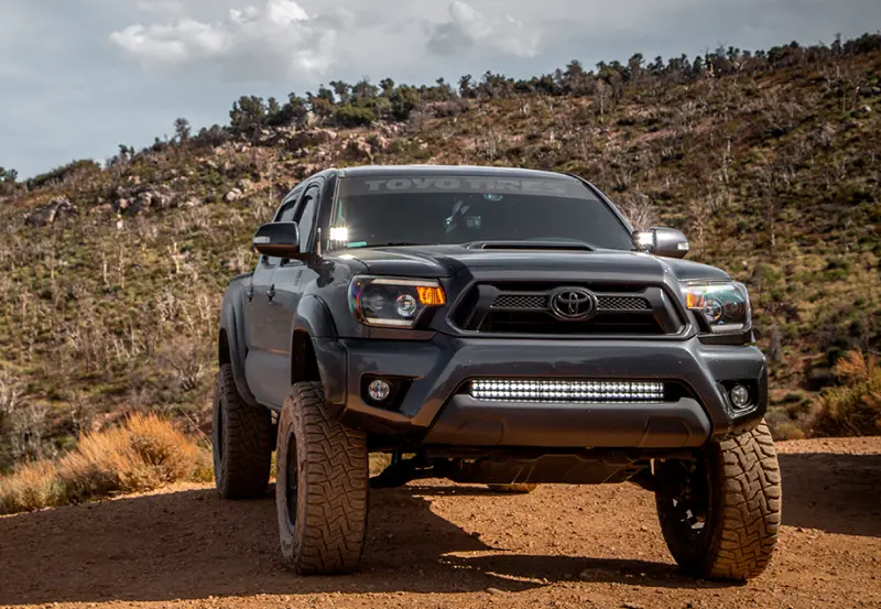Cali Raised 05-15 Toyota Tacoma 32In Lower Bumper Hidden Led Bar Brackets Kit-Blue Backlight - Small 1