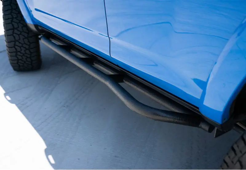 Cali Raised 10-24 Toyota 4Runner Trail Edition Bolt On Rock Sliders - Kick Out / Bedliner 1