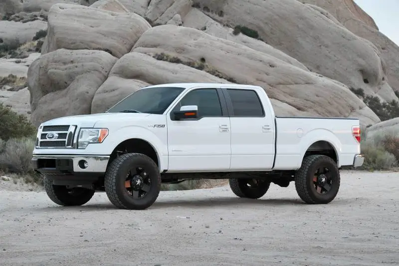Fabtech 09-13 Ford F150 4Wd 4In Perf Sys W/Dlss 2.5 C/O Resi & Rr Dlss 2