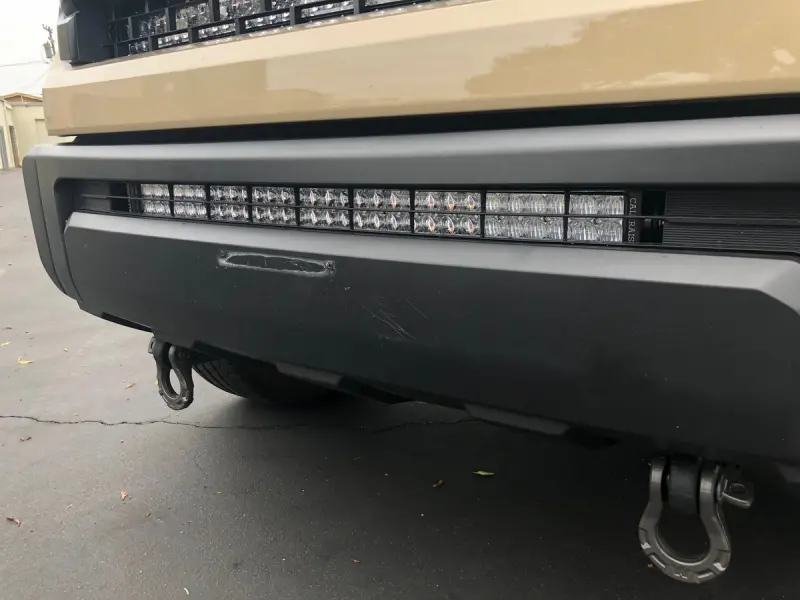 Cali Raised 14-21 Toyota Tundra 32In Lower Bumper Hidden Light Bar Kit - Blue Backlight Small 1